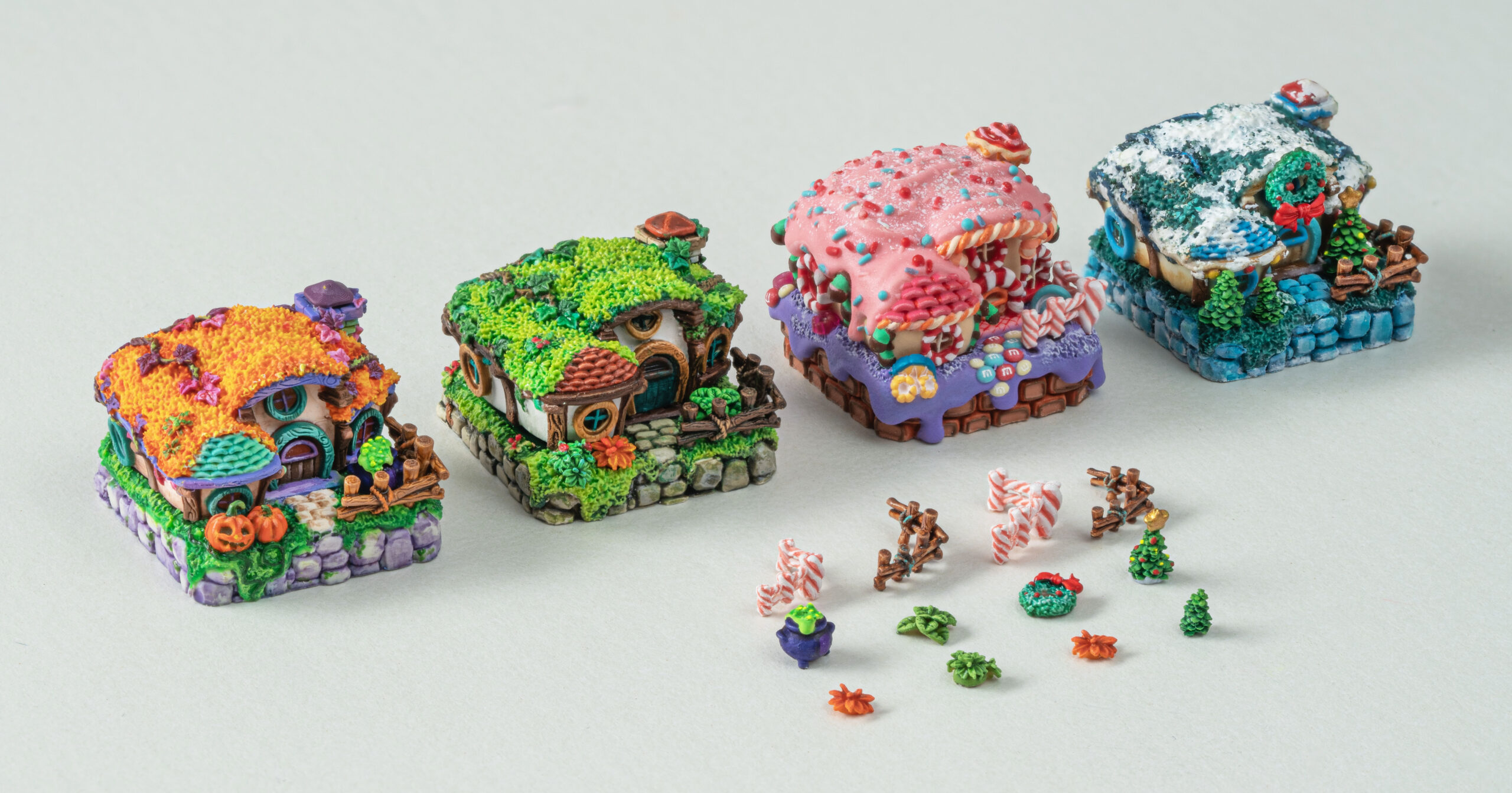 Colourful artisan keycaps miniature seasonal-themed houses with decorations.