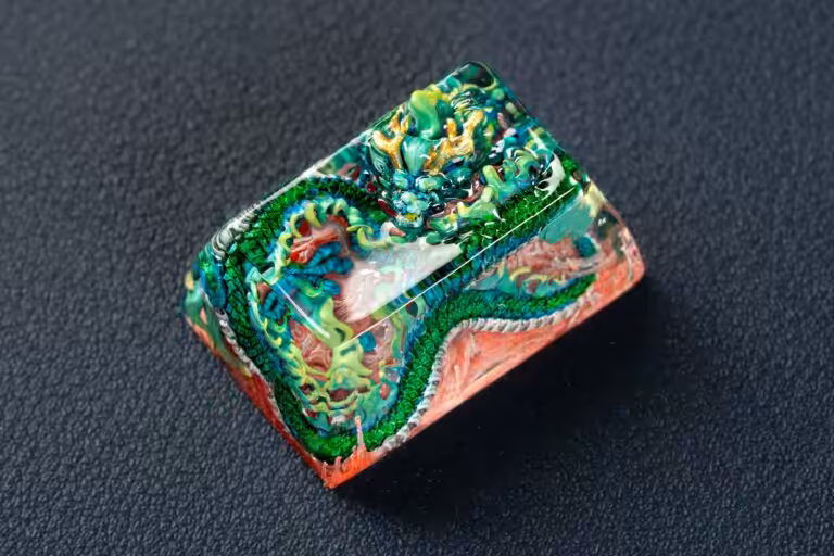 Colorful dragon carved resin art block on dark background.