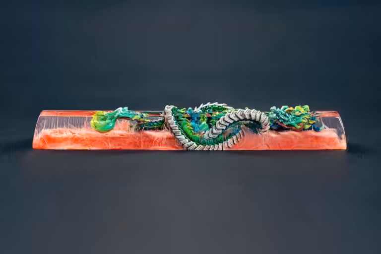 Colorful dragon sculpture encased in clear resin block.