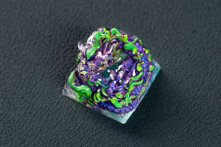 Colorful abstract polymer clay sculpture on dark background.