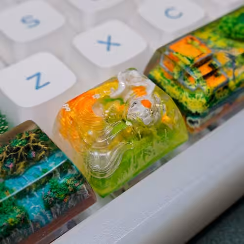 Colorful artisan keycaps on mechanical keyboard.